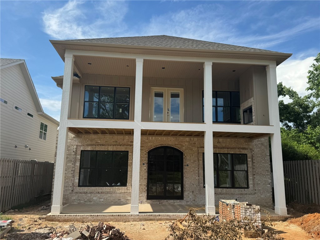 Brand New Construction—Almost Complete; Walking Distance to the Square! Loaded with premium upgrades throughout; enjoy an open floor plan with two spacious living areas, perfect for entertaining and everyday living. A private In-Law suite/apartment sits above the detached garage—ideal for guests, or rental income. The heated 3-car garage comes pre-wired for an EV charger and includes in-ground storm shelter designed to safely accommodate 8 people. The outdoor living space is a true highlight—featuring a built-in outdoor kitchen, fireplace and ample space to add your dream pool! Built with energy efficiency in mind, the home includes blown-in wall insulation and solar board roof decking. The chef’s kitchen will be equipped with high-end appliances, including a 48” Wolf gas range, built-in full-size refrigerator and freezer and separate under-counter ice maker. Luxury, efficiency, and unbeatable location—don’t miss this rare opportunity to live just steps from the Square in a brand-new, thoughtfully designed home.