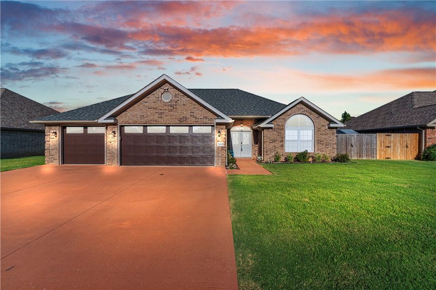 Sellers are generously offering an interest rate buy-down option with an acceptable offer! Single-story all-brick, freshly painted, energy-efficient retreat in the sought-after College Place—just moments from Walmart Headquarters, Downtown Bentonville, Bike Trails, & Eighth Street conveniences. Functionality, comfort, & innovative technology, all set on a landscaped oasis with a 10-foot deep pool with a diving board & auto-fill valve, winter cover, & wiring ready for a hot tub. A rare find offering a 3-car garage with a mini-split HVAC, epoxy floors, & new insulated doors. Paid off solar panels (33 with Enphase microinverters), producing up to 1.2 MWh/mo. in peak seasons. Smart home tech: exterior security cameras, WiFi-enabled thermostat, smart front lock, & irrigation system. Enjoy a gas fireplace, upgraded stainless steel appliances, and a two-drawer dishwasher. Primary bathroom offers a large jetted tub & spacious walk-in shower. The tankless water heater and the June 2025 brand-new roof are other features.