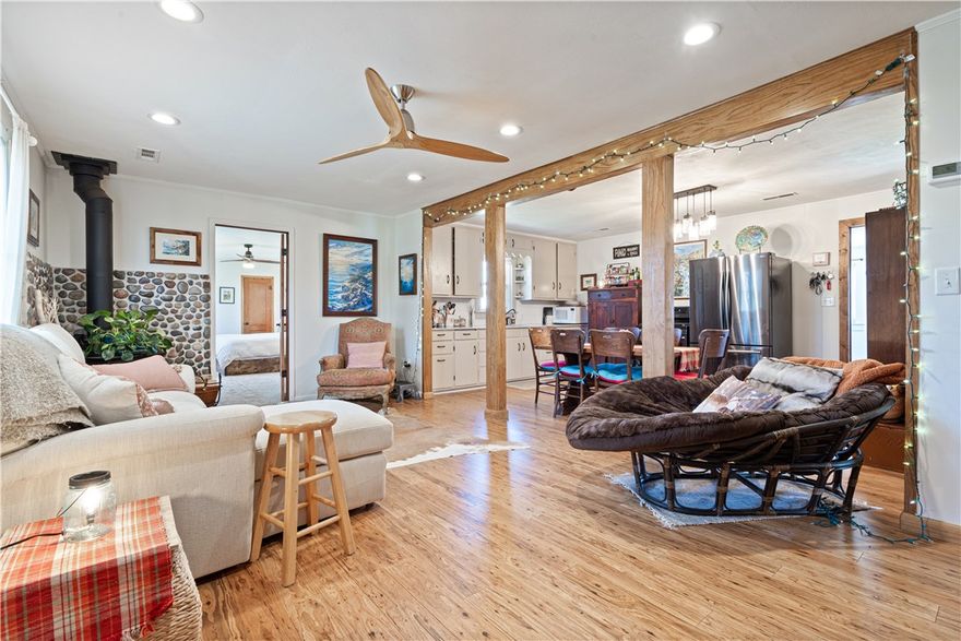 Escape to your private retreat on 9.37 acres m/l, just 20 minutes from Fayetteville or Huntsville. This restored 1951 home, remodeled in 2017, offers 1,152 sq ft of comfortable living. The open concept main room boasts bamboo flooring and a Harmon wood stove with glass front.  Three spacious bedrooms and one with one quarter bath all tastefully appointed. Recent water heater and softener, plus a mudroom with shower for easy cleanup. 

The property includes multiple quality outbuildings, featuring a fully insulated 30x40 shop, provision building with electricity, and additional garage/storage space. Enjoy a pond, garden area, fire pit, and a modernized outhouse near outdoor spaces.

A 75-ft well with Bison pump and dedicated outdoor watering provide reliable water access. RV pad with 50-amp hookup adds convenience for guests. A peaceful, functional property designed for comfort and country living.
