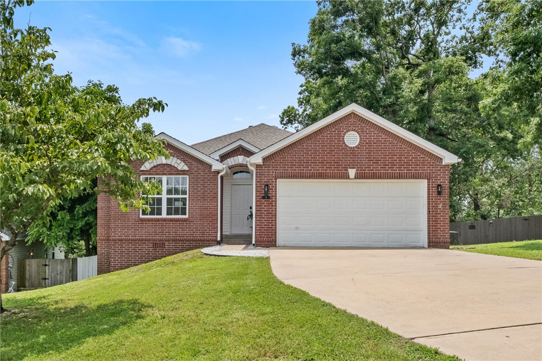 Trailside Living in the Heart of Bentonville! This fully updated 4-bed, 3-bath home with a walk-out basement is steps from world-class bike trails and minutes from Bentonville Square, Crystal Bridges, and the new Walmart Campus. Enjoy brand-new LVP and carpet flooring, a new roof, fresh paint, new deck and stain, updated electrical, and top-tier 3CM granite countertops. The kitchen features new appliances, and the smart master bath includes a rain + jet shower system, motion lighting, electric mirrors, and new vanity lights. Upgrades continue with new fans, chandeliers, door hardware, fireplace finish, shower trims, and an inviting outdoor sitting area with improved fencing. No HOA—perfect for a primary home or investment in one of NWA’s most trail-connected neighborhoods. Don’t miss out!