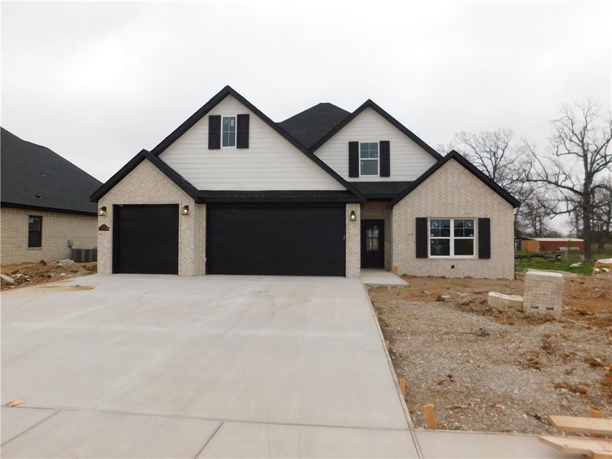 Welcome to this stunning new construction in the sought-after South Pointe Subdivision! This beautifully designed 5-bedroom, 3-bath home with a 3-car garage offers 2,500 sq ft of thoughtfully crafted living space. The open floor plan is perfect for modern living, featuring a bright and airy living room with striking exposed beams, which continue into the spacious master suite. The gorgeous kitchen boasts high-end finishes, ample storage, and a layout ideal for entertaining. Downstairs, a versatile bedroom can serve as a home office or guest room, while the inviting covered back porch provides a relaxing outdoor retreat. Located in the Har-Ber High School district with easy access to I-49, this home is packed with quality features and thoughtful details throughout. Don’t miss your chance to make it yours—schedule a showing today!