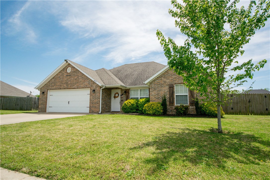 Perfect family home in a great location of the growing community of Prairie Grove. Only 15 minutes West of Fayetteville. 4 Bedroom, 2 Bath split floor plan with all solid surface, wood grain flooring. Large Living area with beautiful tray ceiling and detailed crown molding. Large Privacy fenced back yard. Home is close to schools and within walking distance of the Prairie Grove Aquatic Park.