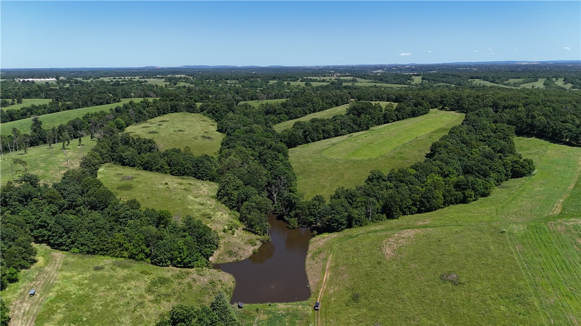 Development Potential. 365 acres of pastureland and timber. Includes approximate 2415sf newly remodeled house, Barn with loft, pole barns and additional garage. Rolling hills and great views! Centrally Located between Springdale, Bentonville and Siloam Springs. Located in the growth pattern of NWA.
