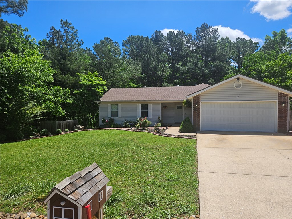 Some of the Best landscaping in all of NW Arkansas; timed irrigation on the incredible rose garden. Raised Flower beds with irrigation on the side of the home. There is a lighted waterfall in the backyard, surrounded by majestic pine trees. There is a patio block walkway around the entire home. There is a beautiful screen porch and a large deck that looks over the picturesque fenced backyard. The interior of the home has been completely remodeled with new flooring, custom cabinets, quartz countertops throughout and new upgraded appliances with Gas Top Range. Master bath and guest bath have custom tiled showers. The open floor plan is great for entertaining, New roof in 2022. It is a must see, the view from the deck and the screen porch is amazing.