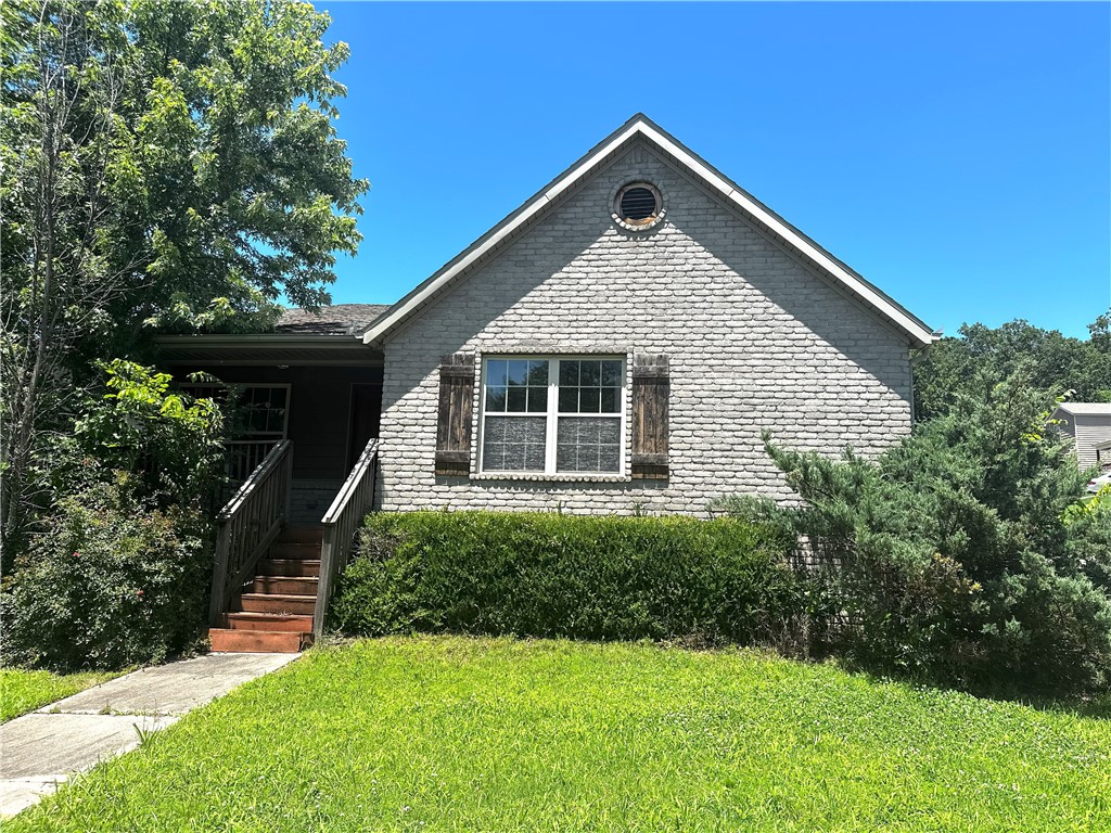 Well-maintained brick home in a highly desirable Fayetteville location on a corner lot just across from Walmart and Lowes on MLK. Conveniently located near the University of Arkansas, I-49, shopping, and dining. This home features functional large open living room with fireplace that leads to huge kitchen with a huge dining area. The kitchen has plenty of wood cabinets and lots of granite counter space to work and cook. All appliances convey including the washer, dryer and refrigerator. Primary bedroom features tray ceiling and ensuite with dual vanities and a large walk-in-closet. Two more spacious bedrooms up front for the kids and a bathroom. 2 car garage with driveway parking allows for multiple vehicles and laundry room off the garage. Out front you can relax under the covered front porch. This is a great opportunity for a family seeking an affordable home or an investor seeking strong rental potential and long-term value in a fast-growing area of Fayetteville for student housing. Professional pictures coming.