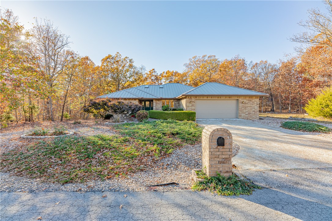 What a fabulous opportunity for you to own a home in a great location at a terrific price! This 3 bedroom, 2 bath home is nestled in the woods on a quiet cul-de-sac near the Branchwood Recreation center. Plus is has a Dining Room, a breakfast nook and a four season Sunroom! The Living Room features a cathedral ceiling and gas log fireplace. The Kitchen has newer appliances and the Refrigerator conveys! The HVAC is only 8 years old and in perfect condition. The metal roof was installed just a year ago and comes with a transferable long term warranty! You don't have to fret if there's a storm that knocks out power...there's even a generator to keep you up and running. And if the storm gets severe, there's even a built-in shelter under the garage floor! The only update needed is some new carpet...but other than that...it's ready for you. The backyard has a nice deck and a fenced yard. Professional photos to follow...but come see it in person today...it won't last long!