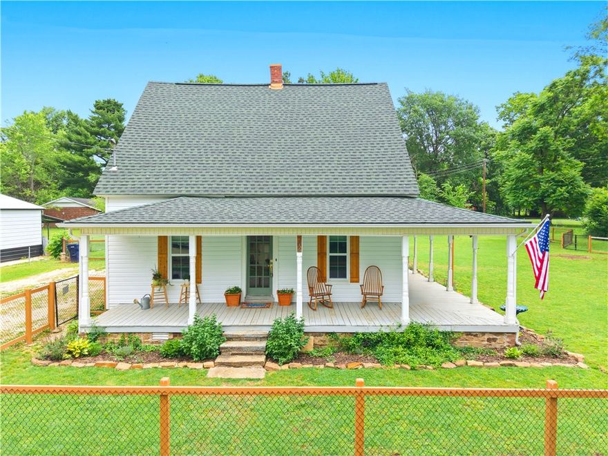 Charming Historic Farmhouse in the Heart of Prairie Grove! This beautiful 4-bedroom, 2-bath farmhouse sits on a spacious .52 acre m/l lot right in the heart of Prairie Grove, offering the perfect blend of character and modern updates.  Step inside to find newer laminate flooring and a warm, inviting layout featuring a cozy fireplace in the kitchen—perfect for gathering and everyday living. The kitchen is equipped with stainless steel appliances, all less than 3 years old (excluding stove).  Recent updates include a newer roof on both the home and detached 1-car garage, plus the garage has been fully insulated—great for storage, hobbies, or workspace. The entire siding on the home has also been replaced, giving it fresh curb appeal and added peace of mind.  Outside, enjoy a nice front porch, established flower beds, and a chain-link fenced yard, all on a generous lot with room to spread out and enjoy.ous lot with room to spread out and enjoy.