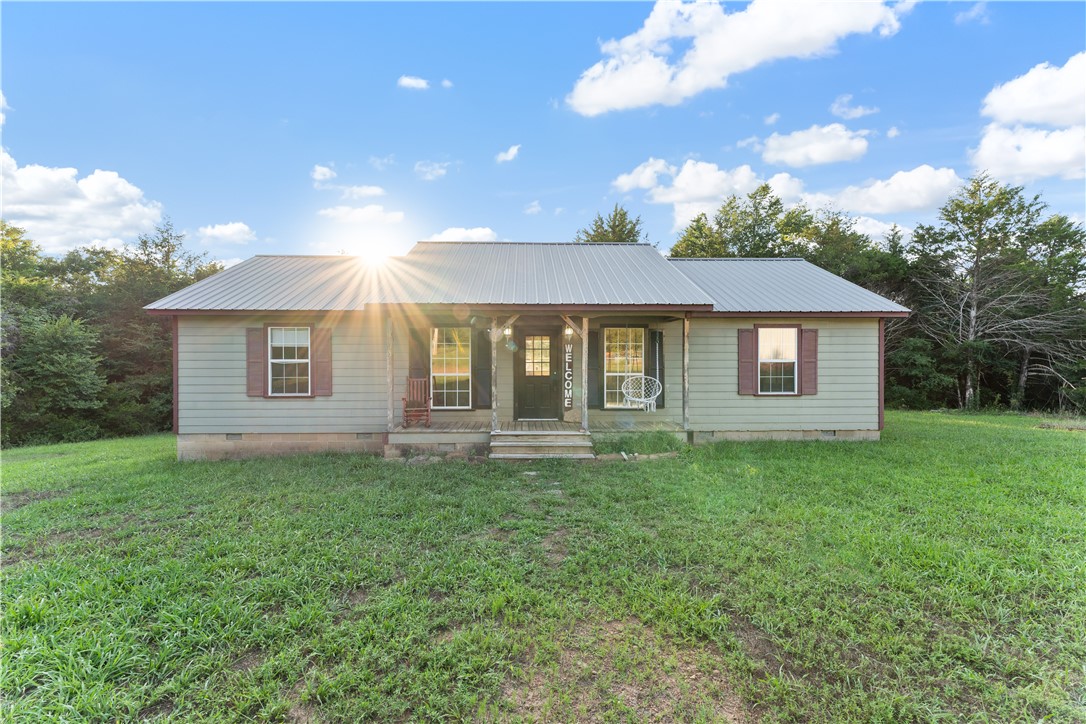 Secluded home right out of town on 5 acres and a 40x60 shop! Cozy home perfect for everyone and full of opportunity! Split floor plan. Sit on the back porch and enjoy your coffee and the view! The land is so peaceful and bring so many options for the new homeowners! Only 8 minutes from the heart of Huntsville, where you can find shopping, school, and so much more.