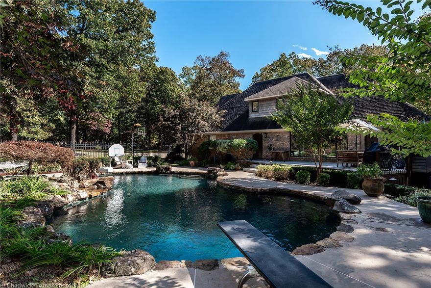 Breathtaking scenery out every window!  Enjoy your privacy on this 4.5 acre estate, yet live right “in town” close to everything. Warm and cozy interiors create the serenity you are looking for!  From the hand- scraped Oak floors, to Amish beams & floor to ceiling windows, this home has so much character!  Entertain in the designer kitchen, host a pool party, or have friends over for the big game in the bonus room.  Relax in your sauna or work out in your home gym, this home offers it all!