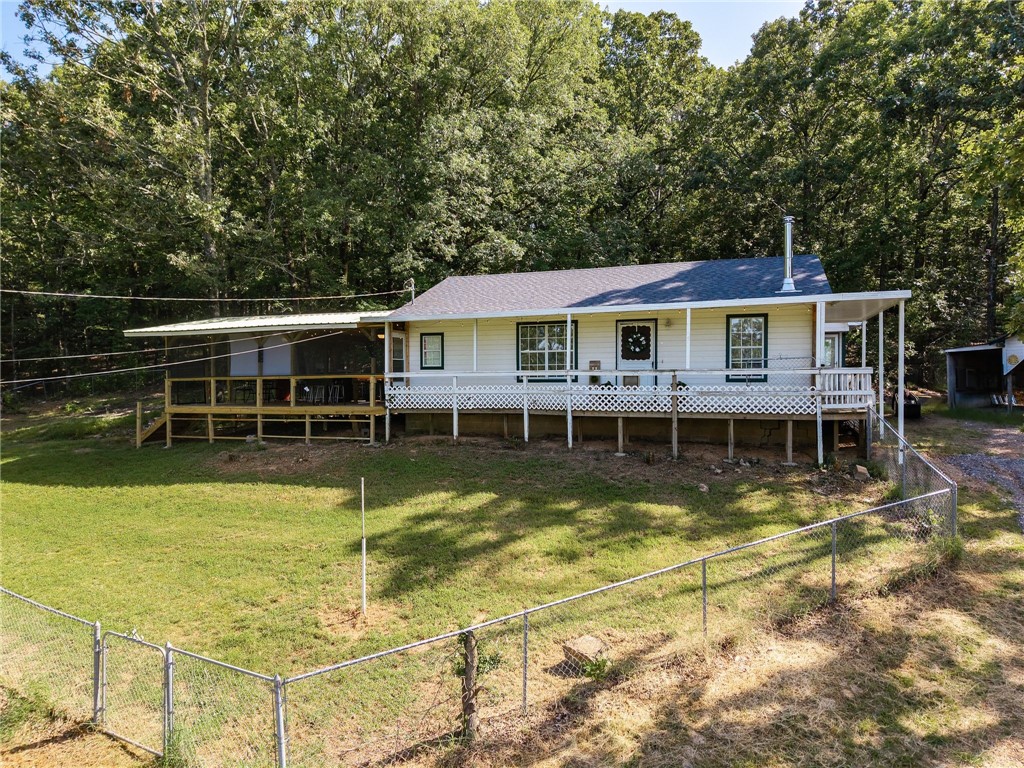 Settle into this charming 3 bedroom, 1.5 bath home with a detached 1 car carport on 1.66 acres in Mountainburg, offering room to breathe and feel at home! Inside, newer solid-surface flooring throughout ensures durability and easy upkeep. The kitchen offers ample cabinet space, making meal prep and storage a breeze. Both bedrooms are comfortably sized, and a large utility room adds extra convenience for laundry and organizing essentials. Outside, enjoy a NEW spacious covered deckāperfect for entertaining or quiet momentsāNew HVAC system and a fenced-in yard! Short 8 mile drive to Lake Fort Smith - enjoy hiking trails, boating, fishing, and kayaking. 35 miles to Fayetteville and about 30 miles to Fort Smith. 1 additional homes for purchase 800 Barton Hill Ln - 4 bed 2.5 bath on 15.12 acres