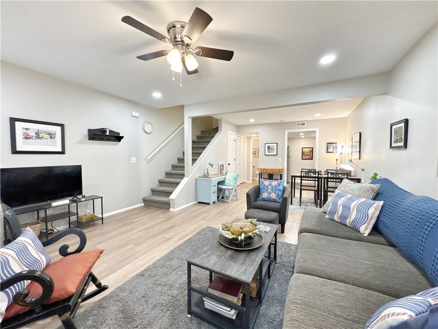 MOTIVATED SELLER! Completely Renovated Townhome with a beautiful view year round! Step into this remodeled 2-bedroom, 1.5-bath, two-story townhome where nearly everything is brand new! Enjoy peace of mind with updated plugs, switches, recessed lighting, and ceiling fans. The home also features fresh drywall and paint throughout, luxury vinyl plank flooring, and new carpet. The kitchen has granite countertops and stainless steel appliances—all of which convey and are less than a year old. Bathrooms are updated with stylish matte black fixtures and feature modern electric mirrors for that extra touch of luxury. Upstairs, a new sliding glass door opens to a private balcony off the bedroom with beautiful wooded views. Laundry room is located convenient to the bedrooms and master bathroom, washer and dryer is less than a year old and conveys. The front porch also offers a peaceful spot to relax. Located conveniently to trails, country club, golf, lakes, and pools.