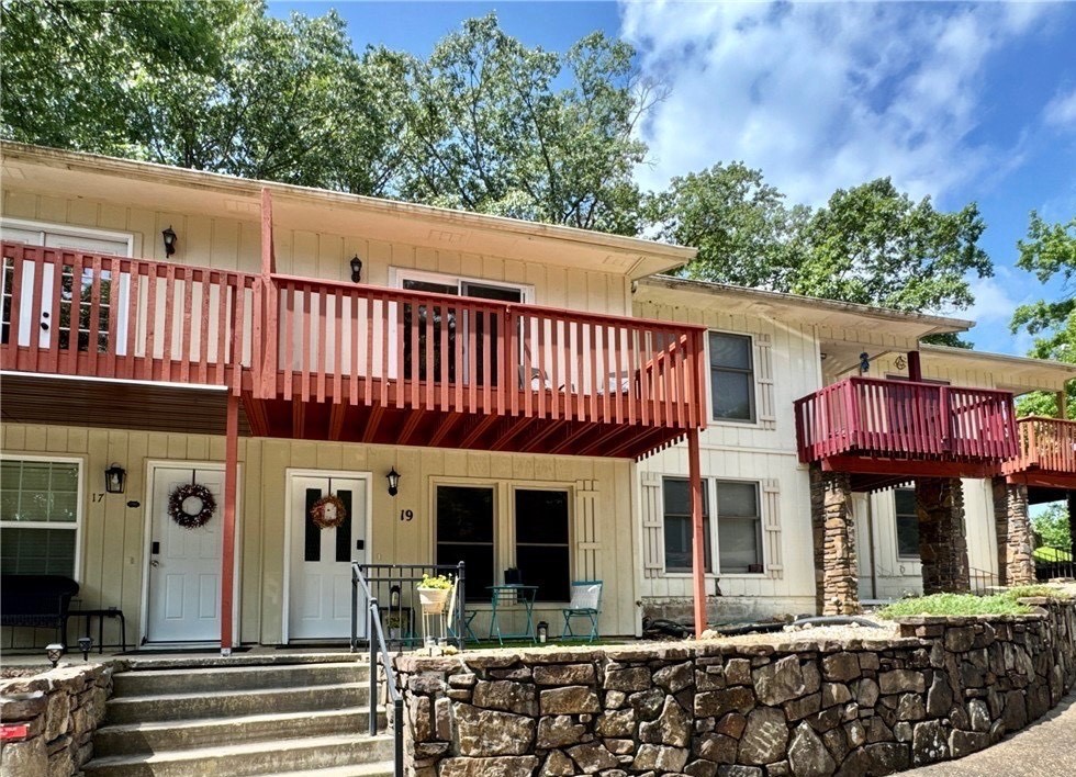 Completely Renovated Townhome in the Heart of Bella Vista! Step into this beautifully remodeled 2-bedroom, 1.5-bath, two-story townhome where nearly everything is brand new! Enjoy peace of mind with updated plugs, switches, recessed lighting, and ceiling fans. The home also features fresh drywall and paint throughout, luxury vinyl plank flooring, and new carpet. The kitchen has granite countertops and stainless steel appliancesāall of which convey and are less than a year old. Bathrooms are updated with stylish matte black fixtures and feature modern electric mirrors for that extra touch of luxury. Upstairs, a new sliding glass door opens to a private balcony off the bedroom with beautiful wooded views. Laundry room is located convenient to the bedrooms and master bathroom, washer and dryer is less than a year old and conveys. The front porch also offers a peaceful spot to relax. Located conveniently to trails, country club, lakes, pools.