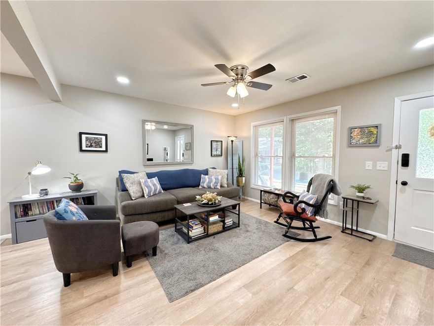 Completely Renovated Townhome with a beautiful view year round! Step into this remodeled 2-bedroom, 1.5-bath, two-story townhome where nearly everything is brand new! Enjoy peace of mind with updated plugs, switches, recessed lighting, and ceiling fans. The home also features fresh drywall and paint throughout, luxury vinyl plank flooring, and new carpet. The kitchen has granite countertops and stainless steel appliances—all of which convey and are less than a year old. Bathrooms are updated with stylish matte black fixtures and feature modern electric mirrors for that extra touch of luxury. Upstairs, a new sliding glass door opens to a private balcony off the bedroom with beautiful wooded views. Laundry room is located convenient to the bedrooms and master bathroom, washer and dryer is less than a year old and conveys. The front porch also offers a peaceful spot to relax. Located conveniently to trails, country club, golf, lakes, and pools.
