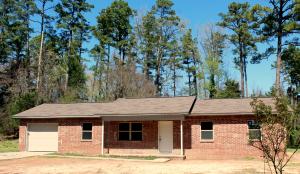 Beautifully updated 4 bedroom, 2 bath on 1.5 acres for under $100,000 just out of town! With new heat and air, new roof, carpet, paint, light fixtures, windows, a totally remodeled kitchen and more there is nothing to do but move in! There is even a garage and separate laundry room! All this in a great Mill Creek country location!