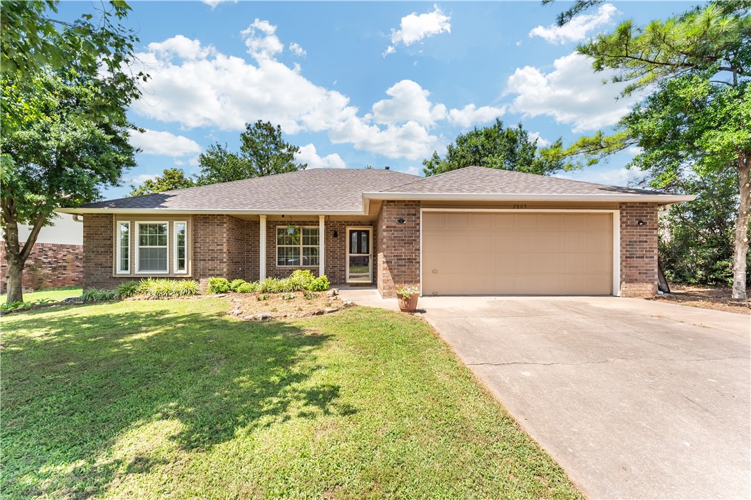 Location! Less than 1 mile to Walmart Wellness Center, Memorial Park, and I-49! Will be a short walk to the new Walmart Campus. Hard to find 4BR 3BA house with two living areas on one level. The second living area and second primary bedroom with 3rd bathroom would work perfectly for a mother-in-law suite. This area is so versatile, right now being used as a family room. All bedrooms have walk in closets. Open floor plan. Hard surface floors throughout. Wood burning fireplace in the living room which is open to the kitchen. Walk in pantry. Sink in laundry room. Several updates: Lenox HVAC with variable speed & filtration system 2023 and includes maintenance contract through July 2025. Water heater 2022. Fence 2021. Roof 2020. Nice patio in the backyard. Vegetable garden. Storage shed. All brick exterior.