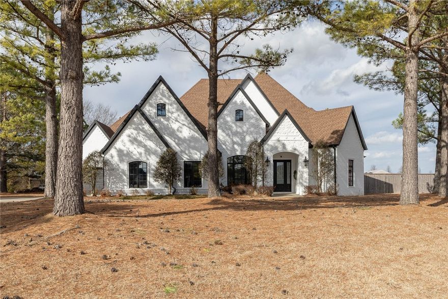 This newly renovated single family home is located in a highly desired neighborhood in Fayetteville, AR. This home has beautiful mature pine trees that fill the front yard, as well as spacious landscaped backyard. Upon entrance, you are greeted by high ceilings, wood floors, fresh paint, & large windows that create a bright and inviting space. This open floor plan seamlessly connects to the kitchen, living room & into the backyard that is perfect for entertaining. Attention to detail is present in the kitchen with quartz countertops, double oven, gas stove, a pot filler, and a large pantry. The oversized primary bedroom is filled with natural light, marble attache floors and decorative ceiling. The large primary bathroom contains a steam shower, stand-alone tub, beautiful stained glass window and walk-in closet. On the opposite side of the house you will find three additional bedrooms all with on-suite bathrooms. This home also has an office with custom built-ins, bonus room with a fireplace & formal dining room.