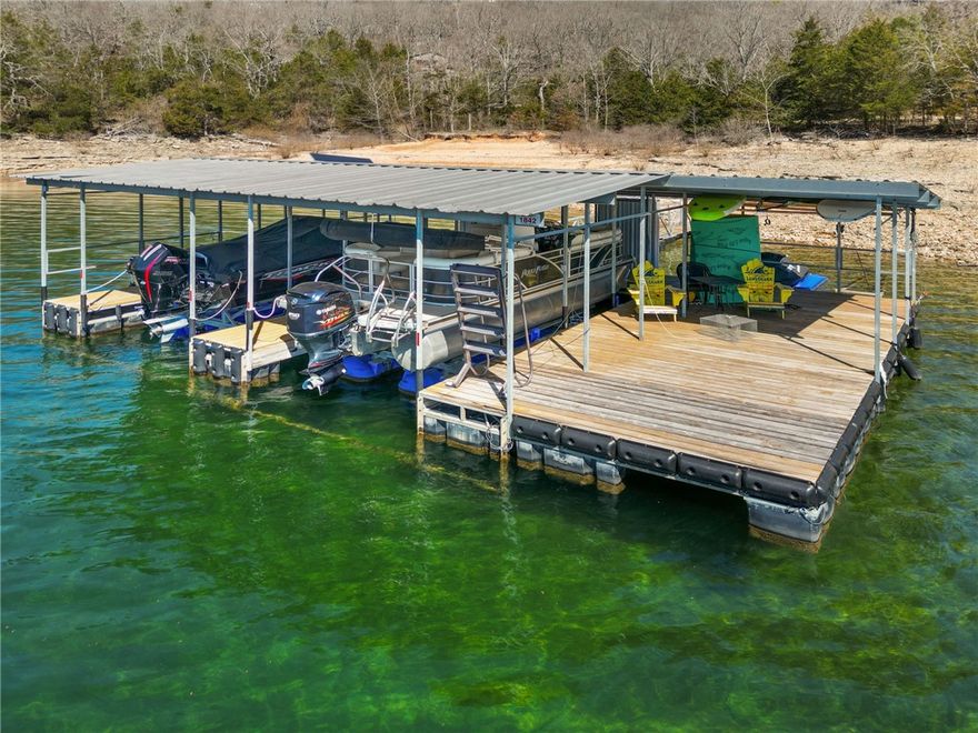 Welcome to this exceptional lakefront estate on Beaver Lake, offering space, privacy, and incredible amenities in a stunning waterfront setting. The main home features 5 bedrooms and 4 bathrooms, thoughtfully designed for comfortable living and entertaining while capturing beautiful lake views from multiple vantage points. 
Guests and family will appreciate the separate 1-bedroom, 1 bath guest house with its own garage, creating the perfect space for visitors or extended family
Outdoor living is just as impressive with a private 2-slip dock with 10' x 26' slips for lake days and an inviting outdoor fireplace and grill area ideal for gathering while enjoying the peaceful surroundings.
This remarkable property also offers outstanding storage, parking and workspace with a detached 3-car garage with carport, the guest house garage and a detached 1-car garage, providing plenty of room for vehicles, boats, and lake toys.  The property is ideally located near the dam know for its clear, deep waters.