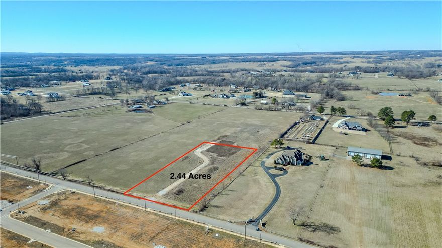 Build your dream home on 2.44 acres of prime land! Beautiful flat lot located in a highly sought-after Bentonville area off Pleasant Grove Rd. Bentonville school district. Survey has been done and corners have been marked by surveyor. Seller working on getting a water line. 15 minute drive to XNA airport, 11 minutes to Pinnacle Hills Promenade, and 15 minutes to Walmart Home Office. Experience the freedom to design and live the way you want without the restrictions of HOA or POA. Need more space? An additional adjoining 2.44 acre lot is also available for purchase. Don’t miss out. Call to schedule a private tour.
