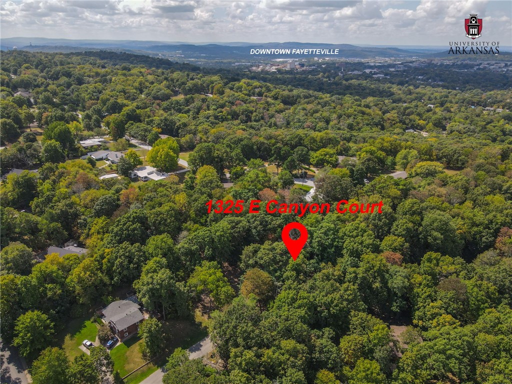 Nestled in one of Fayetteville's most sought-after residential neighborhoods, this stunning .91-acre lot offers the perfect canvas to build your dream home. Located on Mount Sequoyah, you'll enjoy tranquil living while being just minutes away from the best the city has to offer.
A short drive brings you to the vibrant nightlife and dining scene on Dickson Street, while the serene beauty of Gulley Park is nearby for peaceful outdoor activities. And, of course, you're right on Mount Sequoyah, a local gem with stunning views and nature trails.
This expansive lot provides both privacy and convenience in a picturesque setting. Don’t miss your chance to create something special in this unbeatable location!