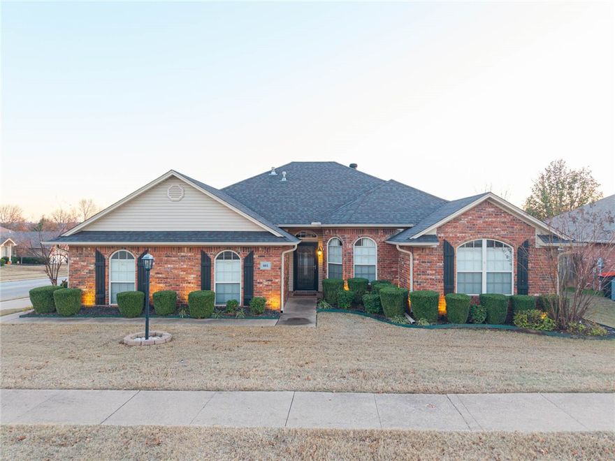 Stunning Northridge 4-bedroom, 2-bath home loaded with extras. The kitchen was completely remodeled in 2020 with beautiful quartz countertops, a marble herringbone backsplash, pantry, under-cabinet LED lighting, stainless steel appliances, and a breakfast bar & seller is leaving barstools. Fresh paint and updated lighting throughout. The spacious living room features real wood floors and a gas log fireplace. Split floor plan with a large master bedroom. The master bath boasts a walk-in shower, double sinks, whirlpool tub, and walk-in closet. Sellers are offering a $5k carpet allowance for the bedrooms. A bonus room off the covered back patio is heated and cooled, perfect for an office, storage, or workout space. New storm doors on the front and back, plus a new insulated garage door. Situated on a corner lot with vinyl fencing and landscaping lights for added security.