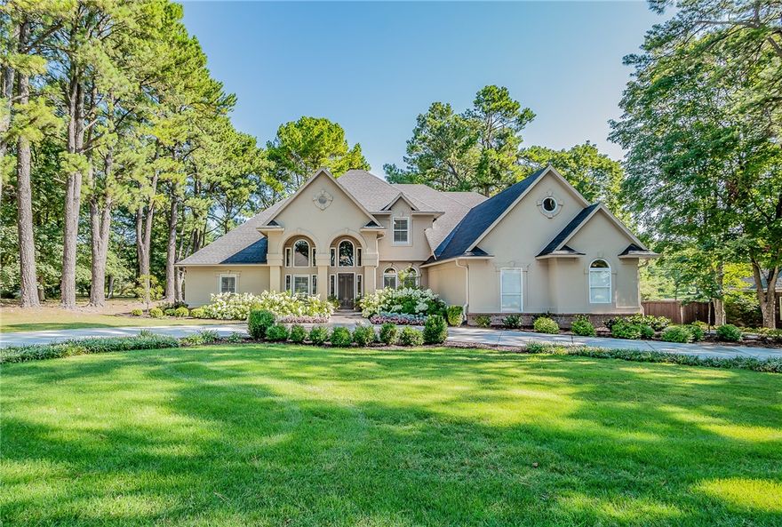 Welcome to this elegant home nestled in one of the most coveted pocket neighborhoods. This hidden gem is located in the best location while offering the privacy and tranquility of a secluded retreat. Every detail is magazine-worthy with notable features including a beautiful 2-story foyer, hardwood flooring, plantation shutters, marble and quartz countertops, custom millwork, designer lighting with oversized windows and doors along the back of the home. The main level features a dining room, multiple living and entertaining areas, a gourmet kitchen, and utility/mudroom. The primary suite and a secondary bedroom and full bath are also comfortably located on the main level. Upstairs leads to two additional bedrooms, full bath with coffee/wet bar, game/bonus room, exercise room, and an office/hobby room with wall-to-wall cabinetry. The lush backyard is a delight with a spacious terrace for entertaining, dining and relaxing, while overlooking the park like backyard. Agent owned.