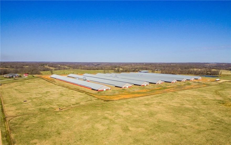 Almost new mega house farm on 79 acres m/l with beautiful 2435 sf home. the (8) Poultry houses are 55 x 600 and fully updated with conveyor belt systems in all houses. Oversized stacking shed and a large well house with office and full bathroom. 18,000 gallon "train car" LP system. 1 deep well with large tap city water backup. Large grazing areas for livestock as well.