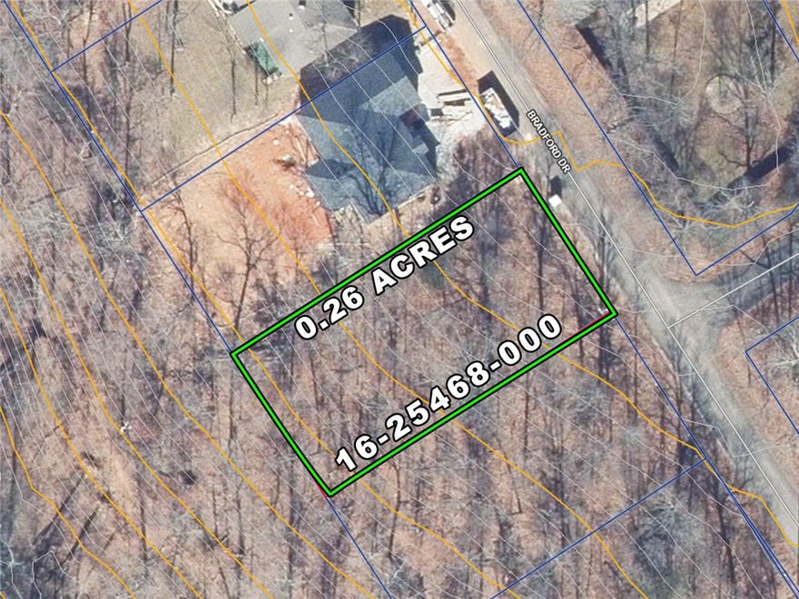 Check out this cookie cutter Buildable lot with a moderate slope, between two newly built homes.  This lot has already had a perc test and would be suitable for at least a 2-Bedroom Home.