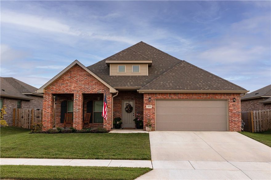 Motivated Seller! Step into your beautifully finished and thoughtfully designed floorplan with space for the whole family to spread out. The open and airy first floor features a large living room beaming with natural light and an elegant electric fireplace. The spacious kitchen has stylish black stainless steel appliances and an oversized walk-in pantry for all of your storage needs. The primary bedroom is located on the first floor with an ensuite bath with double vanities, a large soaking tub and walk-in shower. The oversized primary closet flows effortlessly into the laundry room for ultimate accessibility & convenience. The 2nd floor has 2 additional bedrooms, a full bathroom and a flex/bonus space ideal for a play/lounge area, side hustle or office needs. The fully fenced backyard boasts a covered patio with a 10'x20' extension. Garage is wired for 240V EV chargers. Located less than 10 miles from downtown Bentonville, XNA airport and Walmart HQ. Priced to sell and below market comps!
