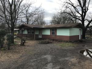 Don't judge a book by its cover!!! There is so much potential in this property. Home needs some TLC, but the lot is large and goes from street to street. Conveniently located close to all amenities, the possibilities are endless. Whether you are looking for a fixer upper, rentals or both, this could be your next project!!