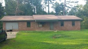 Brick Ranch home that has so much potential. Just minutes from town in great location on paved road is where you will find this 1398 Sq Ft home with split floor plan, 4 bedrooms, 2 full baths, kitchen and living area. Priced to sell