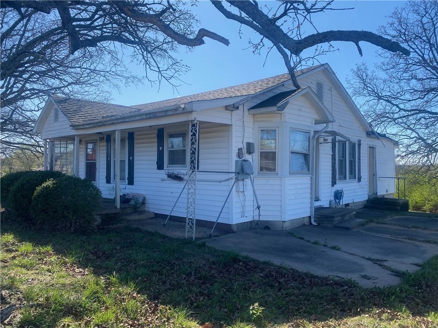 Beautiful property to build your dream home on and have a few head of livestock or a great commercial piece. Lots of potential with lots of flexibility. This property has an older home on it that is in bad need of repair or to just be torn down. Selling as is and has no value. There has been a newer home next to the tree line to the South but did burn down several years ago. The property goes on passed the South tree line all the way to the railroad track. Property is just outside the city limits and close to the Primary School.