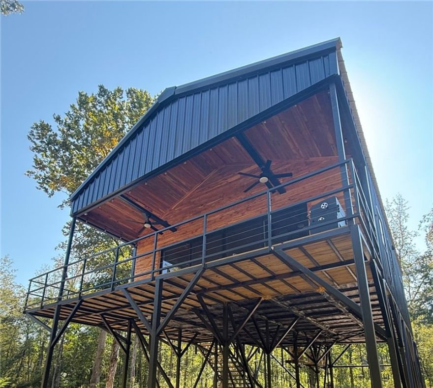 Whether you’re seeking a cozy year-round home or a peaceful getaway, this brand new 2 bed/1bath cabin offers the perfect sanctuary with Little Mulberry Creek frontage. Cabins are located in the Oark area which is known for ample opportunities for outdoor activities like hiking, fishing, trails, floating and exploring the natural beauty of the Ozarks. This stunning new construction cabin offers the perfect blend of rustic charm and modern comfort. Relax and take in the stunning views from your expansive deck overlooking the Little Mulberry Creek. Currently, a successful Air BnB rental "Little Mulberry Bend".