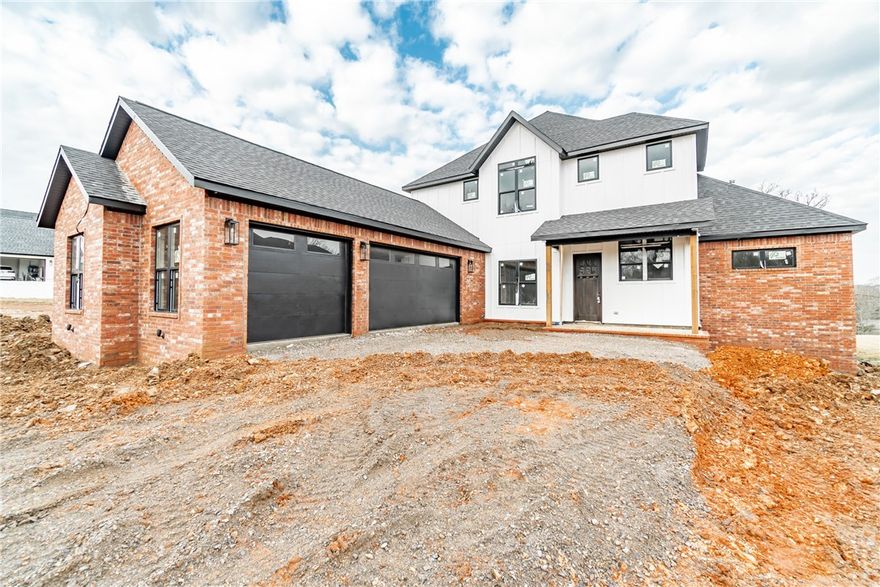 Welcome to this stunning new construction home nestled in the exclusive Autumn Hills neighborhood. With its proximity to schools and the Coler Bike Trails, you will love the convenience of your new location. Boasting a backyard that faces a wooded lot, you can enjoy nature from the comfort of your oversized back patio with outdoor kitchen! From marble countertops throughout downstairs to a professional 48 in range, entertaining has never been easier. The spacious living room features a beautiful fireplace, wood beams, built-in shelving, ample storage space, and an abundance of natural light. Additional amenities include a bonus room, sound wiring, and 3 car garage! Welcome to your dream home!