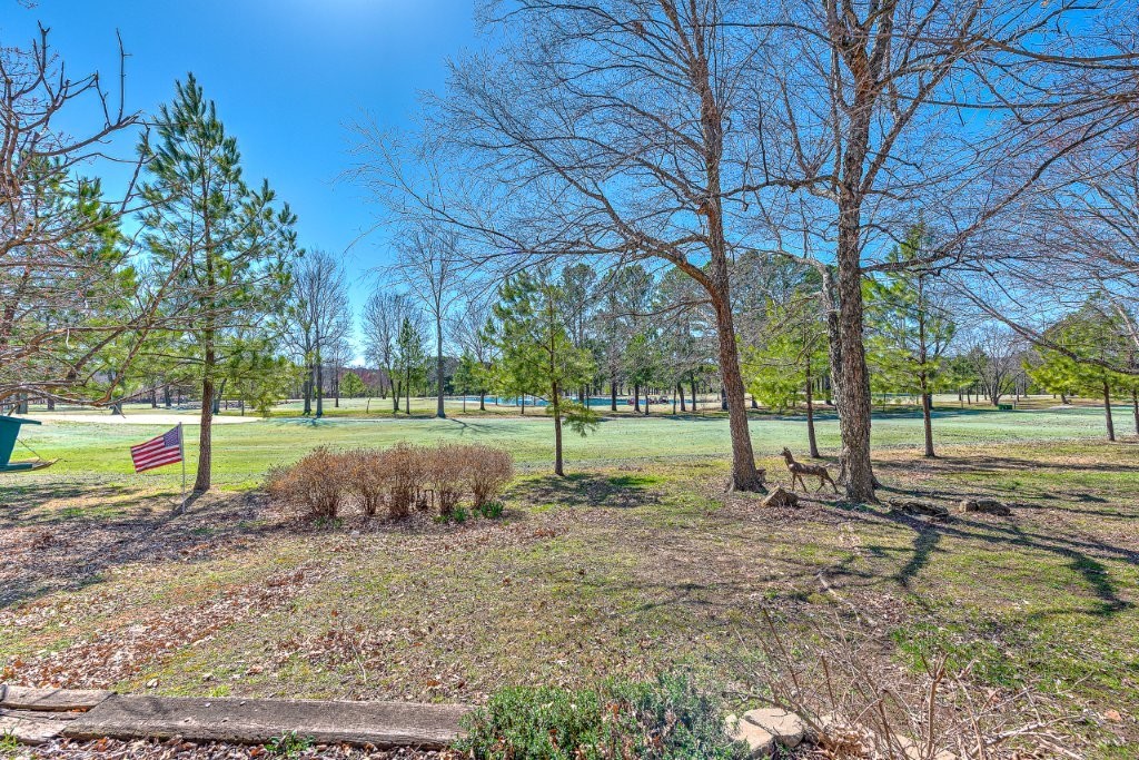 Newly remodeled condo on Paradise Valley Golf Course. New paint, carpet, light fixtures, and countertops. Overlooking Paradise Valley Golf Course, this 4 bed, 2.5 bath condo offers stunning views and unbeatable convenience as it's just minutes from restaurants, shopping, trails, and Washington Regional Medical Center. Features include a main-level primary suite, quartz countertops, hardwood floors, plantation shutters, generous storage, and a two-car garage with extra parking in front. Low maintenance, directly on golf course, and move in ready.