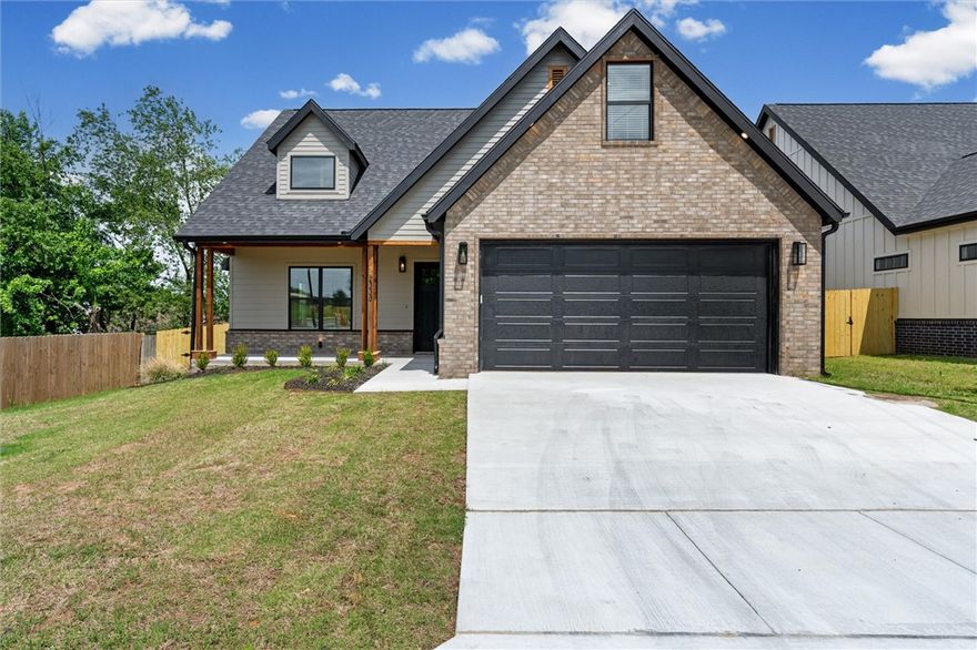 $3500 preferred lender credits!  Fabulous new construction near the Promenade and Rogers Aquatic Center!
These elevated homes showcase stunning design with white oak flooring, high-end countertops, and designer tile selections throughout. Vaulted ceilings and floor-to-ceiling cabinetry create a grand, open feel, while the butler’s pantry, with counters and outlets, keeps your gorgeous kitchen clutter-free.
The primary suite is a true retreat, featuring a spa-like bath with a frameless glass shower wrapped in floor-to-ceiling tile, a garden tub, and dual vanities. The spacious walk-in closet offers custom shelving, drawers, and hanging space for ultimate organization. Upstairs, you’ll find three additional bedrooms and a full bath with the same elevated finishes, plus one room easily doubles as a bonus living area.
Outside, enjoy full sod, front landscaping, and a private backyard with a gate and wood privacy fence!