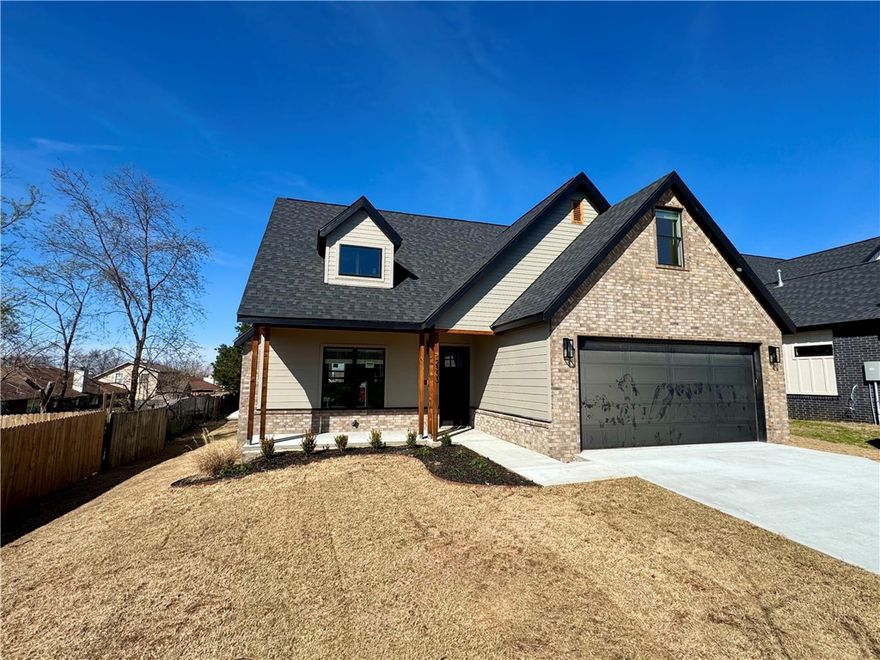 $3500 in closing costs paid by preferred lender!  Fabulous new construction near the Promenade and Rogers Aquatic Center!
These elevated homes showcase stunning design with white oak flooring, high-end countertops, and designer tile selections throughout. Vaulted ceilings and floor-to-ceiling cabinetry create a grand, open feel, while the butler’s pantry, with counters and outlets, keeps your gorgeous kitchen clutter-free.
The primary suite is a true retreat, featuring a spa-like bath with a frameless glass shower wrapped in floor-to-ceiling tile, a garden tub, and dual vanities. The spacious walk-in closet offers custom shelving, drawers, and hanging space for ultimate organization. Upstairs, you’ll find three additional bedrooms and a full bath with the same elevated finishes, plus one room easily doubles as a bonus living area.
Outside, enjoy full sod, front landscaping, and a private backyard with a gate and wood privacy fence!