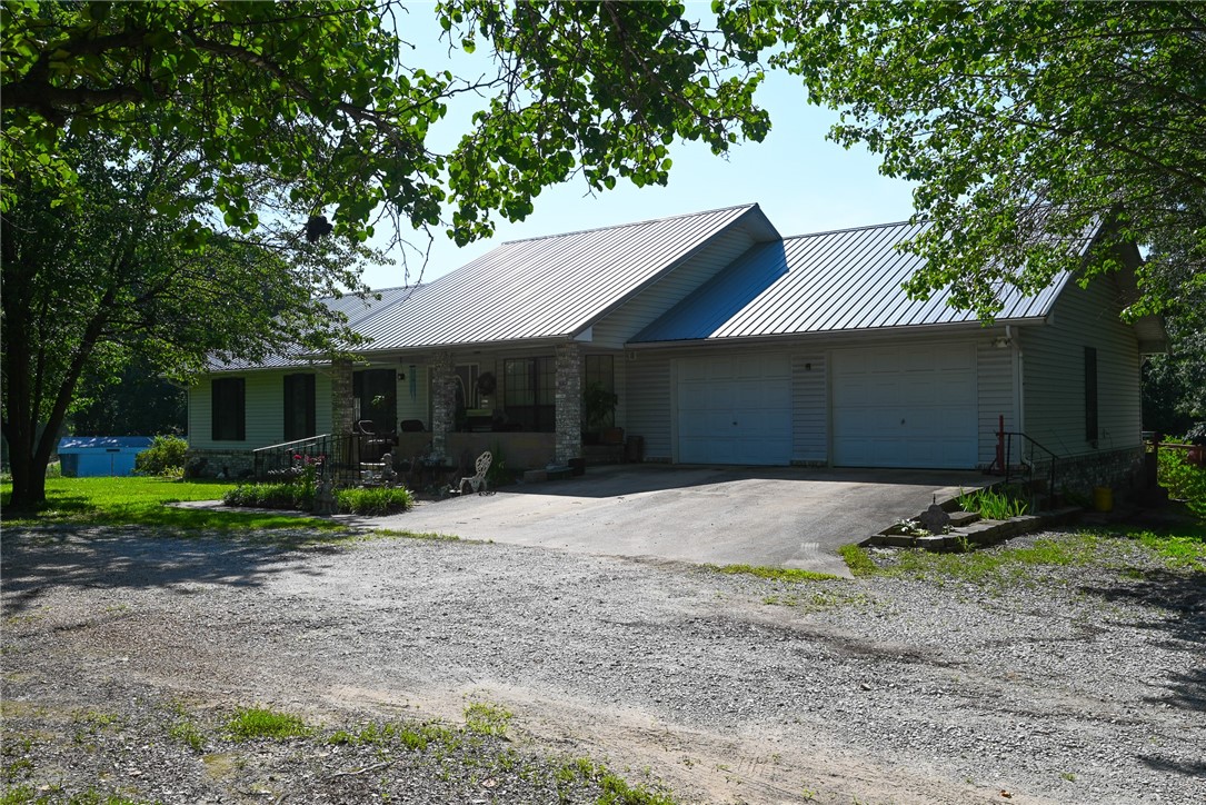 Discover your peaceful retreat in this charming 4-bedroom, 2-bath brick home, perfectly situated on 1.75 acres of beautiful green landscape with mature trees. Enjoy the best of both worlds ā the tranquility of country living with the convenience of being just minutes from town. Inside, you'll find an inviting open living space with high ceilings, ideal for family gatherings and entertaining. For your comfort, the HVAC system was newly installed in 2023/2024. The property boasts a fantastic, oversized garage, providing ample space for vehicles, hobbies, or storage. Plus, there's a huge amount of easily accessible attic storage, ensuring everything has its place. This home offers the perfect blend of spacious living, practical amenities, and serene outdoor beauty.
Please Note: The propane cook stove, propane wall heater, and propane tank will not convey with the property.
Disclaimer: All numbers, square footage, and information provided are deemed reliable but should be verified independently by the buyer.