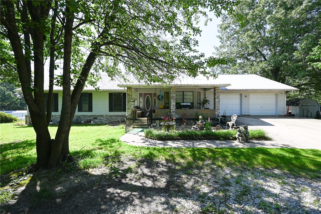Discover your peaceful retreat in this charming 4-bedroom, 2-bath brick home, perfectly situated on 1.75 acres of beautiful green landscape with mature trees. Enjoy the best of both worlds – the tranquility of country living with the convenience of being just minutes from town. Inside, you'll find an inviting open living space with high ceilings, ideal for family gatherings and entertaining. For your comfort, the HVAC system was newly installed in 2023/2024. The property boasts a fantastic, oversized garage, providing ample space for vehicles, hobbies, or storage. Plus, there's a huge amount of easily accessible attic storage, ensuring everything has its place. This home offers the perfect blend of spacious living, practical amenities, and serene outdoor beauty.
Please Note: The propane cook stove, propane wall heater, and propane tank will not convey with the property.
Disclaimer: All numbers, square footage, and information provided are deemed reliable but should be verified independently by the buyer.
