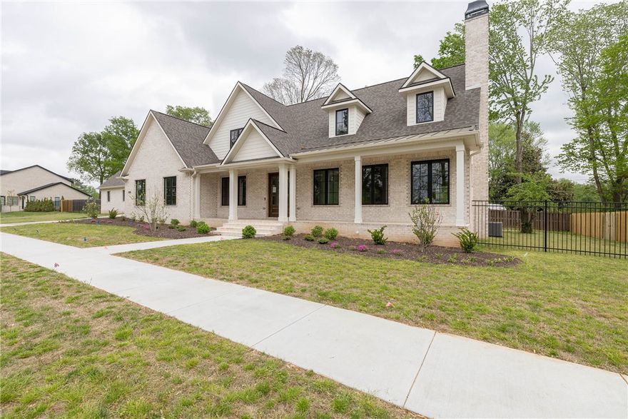 Welcome to your dream home in Fayetteville's Eastern Park! Professionally designed, this home boasts exquisite high-end details & luxurious amenities throughout. Main level features hardwood floors, & an open & airy floor plan. Living room is highlighted by a sleek fireplace, seamlessly flowing into the kitchen that is equipped with quartz counters, high-end stainless appliances, an island with vegetable sink, & pantry. Formal dining room offers access to the covered patio, ideal for entertaining, while the versatile study can serve as a 4th bedroom & includes an adjacent full bath. Retreat to the elegant primary suite, featuring a spa-like bath with walk-in shower, double vanity, & soaker tub, as well as a spacious walk-in closet. Upstairs, you'll find two bedrooms, a full bath, & HUGE bonus area with built-in desks & shelving. Additional amenities include a 2 car attached & 1 car detached garage, high-end lighting & fixtures, & utility room with sink. Don't miss this opportunity to own a truly exceptional home!