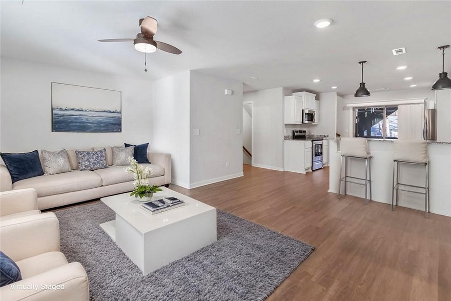 Lock in low-maintenance living in this 3-bedroom, 2.5-bath townhouse in Bourbon Street Townhomes — just steps from the Razorback Greenway Trail System and minutes from the University of Arkansas and downtown Fayetteville. Built in 2018, this 1,420 sq ft, 3-level home features granite countertops, LED lighting, ceiling fans, and a convenient laundry chute. All appliances convey, including the refrigerator, washer, and dryer — truly move-in ready. A 2-car attached garage adds everyday convenience, while the HOA covers water, sewer, lawn care, exterior maintenance, and trash pickup for just $105/month. Electric averages a budget-friendly $120/month on levelized billing. Whether you're a Razorback fan, a trail enthusiast, or simply looking for a turnkey home in a prime Fayetteville location, this one checks all the boxes.