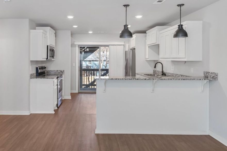 Lock in low-maintenance living in this 3-bedroom, 2.5-bath townhouse in Bourbon Street Townhomes — just steps from the Razorback Greenway Trail System and minutes from the University of Arkansas and downtown Fayetteville. Built in 2018, this 1,420 sq ft, 3-level home features granite countertops, LED lighting, ceiling fans, and a convenient laundry chute. All appliances convey, including the refrigerator, washer, and dryer — truly move-in ready. A 2-car attached garage adds everyday convenience, while the HOA covers water, sewer, lawn care, exterior maintenance, and trash pickup for just $105/month. Electric averages a budget-friendly $120/month on levelized billing. Whether you're a Razorback fan, a trail enthusiast, or simply looking for a turnkey home in a prime Fayetteville location, this one checks all the boxes.