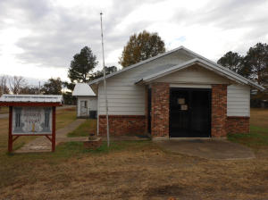 Possible Owner Finance! Use your imagination, lots of possibilities for this former church/library. Spacious kitchen and dining area. Large open area (former sanctuary) that can easily be divided into living and bedrooms. Would make a great Day Care. One restroom (used to be two). Plumbing is still in the crawl space for the 2nd restroom.