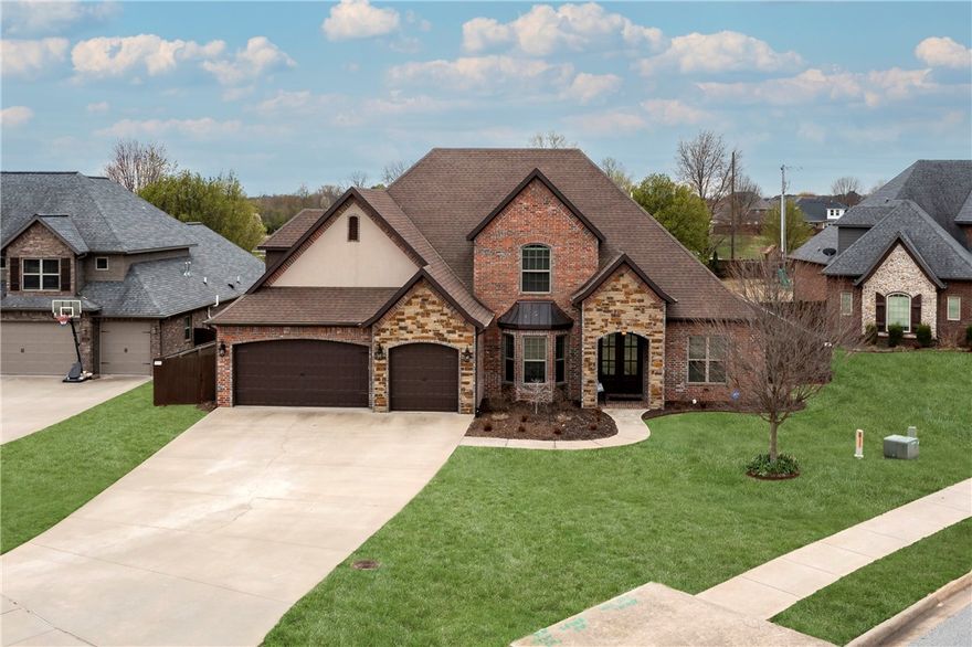 Woods Creeks Subdivision -  premier neighborhood in Northwest Arkansas conveniently located near I-49  in Bentonville. This home is short drive to the Walmart offices, shopping, schools, Crystal Bridges Museum and area sports parks. 2.8 miles to downtown Bentonville. Quality built by  "Homes by Jonathan" it is on a half acre flat lot. It features a  media room/game room, 5 beds, 4 full baths, beautiful cook's kitchen with a professional double oven, range and island, formal dining, 5th bedroom easily flexes as an office. Enormous flat lot just waiting for a pool! Walking path on a nearby street leads to the community catch and release stocked pond.