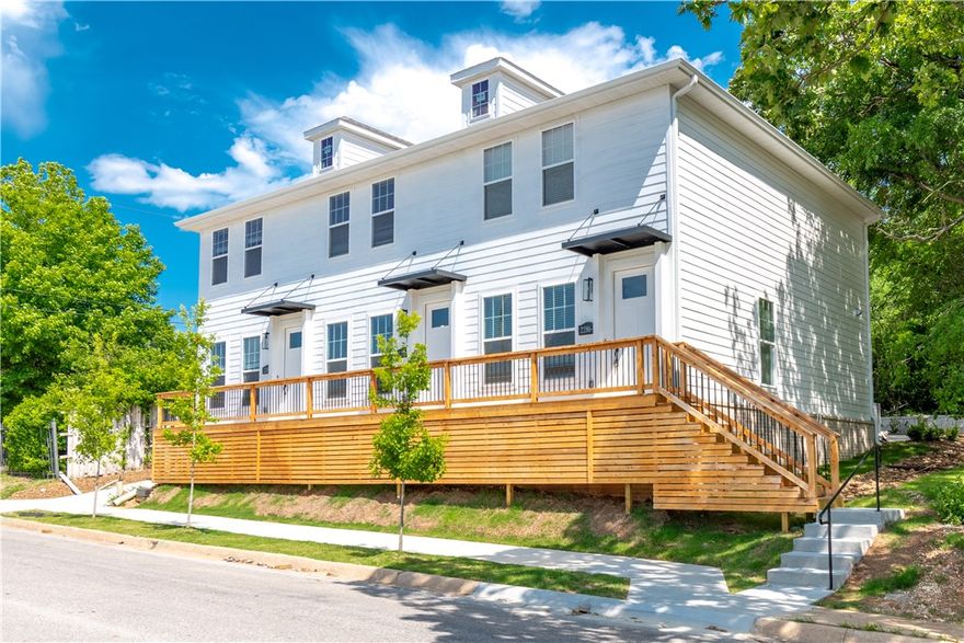 Prime Investment opportunity just down the street from U of A campus, Football Stadium, and Bud Walton Arena!  This brand-new triplex is fully leased with tenants moving in August 1st, 2026.  Annual Gross income of $75,600 for first year.  High potential to increase income year over year.  All three units are 2 bedrooms, 2.5 baths with an open-concept flow. The well-equipped kitchens feature a large island with sleek quartz counter tops, top-tier stainless steel appliances (including fridges), and custom ceiling-height cabinets.  Other features include: durable Luxury Vinyl Plank flooring throughout with tile accents in the bathrooms, all bedrooms upstairs with their own private bathroom, Walking distance to Razorback Stadium, Bud Walton Arena, intramural fields, and so much more!  Fridge, washer, and dryer included for each unit