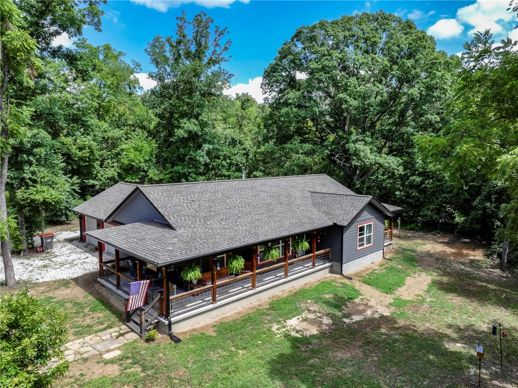 2023 Built custom home built in a very private setting. The home is minutes from Beaver lake, modern and beautiful kitchen with large gourmet gas cooking stove, large walkin closets, this home is built with a 2x6 exterior wall for added strength and insulation. RV parking with hookups. Oversized garage with workshop area. A very quiet setting, come view your next home!