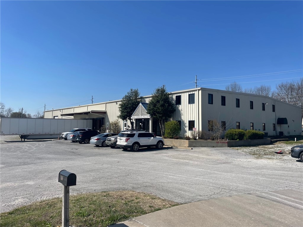 28,564 square-foot industrial warehouse building on 3.56 acres for lease in Rogers. Lot with yard has potential for outdoor storage or expansion. The building has 3 full docks, 1 roll up at grade, 8,816 square feet of office on two floors and 19,748 square feet of warehouse space with 19-foot clear height. The property is close to downtown Rogers amenities.