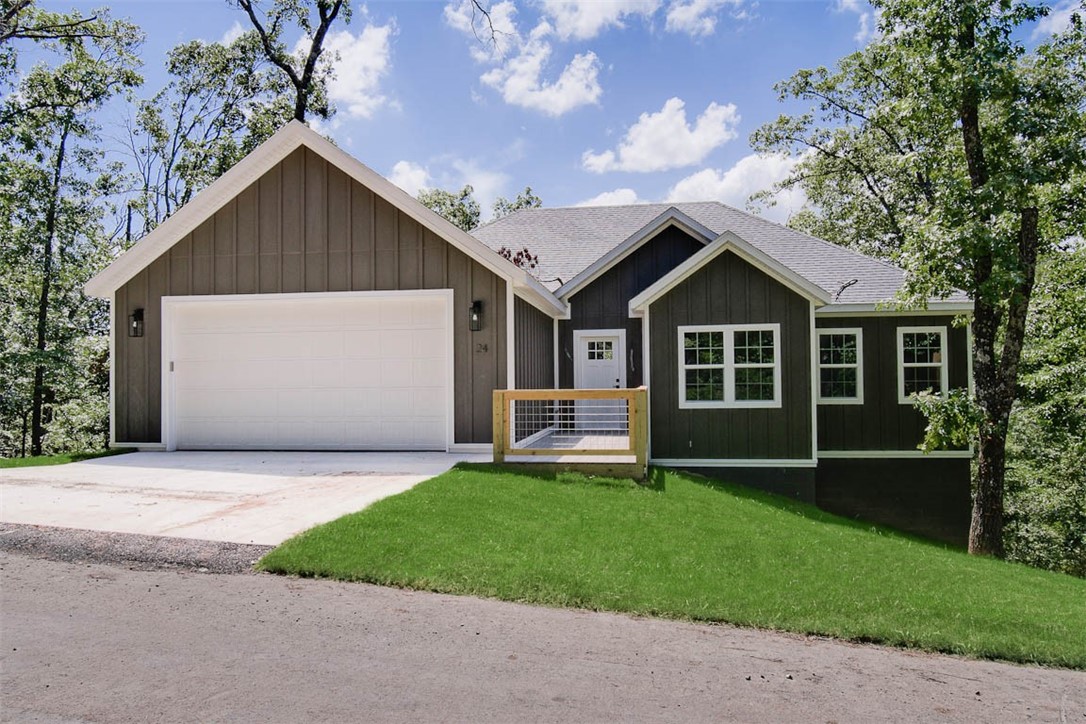 Beautiful, move-in ready new construction home in the heart of Bella Vista just minutes from Lake Ann, the Back 40 trails and within the Bentonville school district! This inviting 3-bedroom, 2-bath home plus an office/flex space features 10-foot ceilings in the living area and notable upgrades throughout including 3cm quartz countertops, Frigidaire Gallery appliances, Pella windows, an extra large panty, charming vaulted ceilings in the primary suite, custom cabinetry, and an insulated garage. Enjoy beautiful scenic views from your oversized covered back patio! Bella Vista community life is vibrant with access to world class amenities, including 7 recreational lakes, recreational centers, 6 golf courses and 150 miles of renowned bike and hike trails!