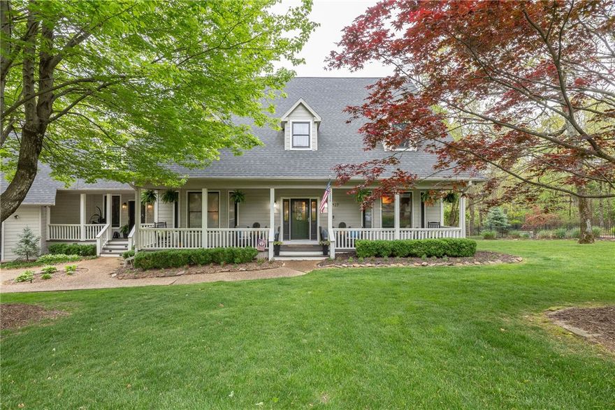 One of Fayetteville's premiere private locations sitting on 4.1 private acres just 7 minutes from downtown. This custom-built home includes a gorgeous updated kitchen, updated primary suite, and bath with a private sunroom that's 22'x12' with a vaulted ceiling, overlooking the woods and nature. Beautiful hardwood floors on main level. The open living and kitchen overlook a 45'x8' glass sunroom with private views. Family and guests alike will love the HUGE bedrooms and bonus room with a built-in bar with sink and mini fridge for entertaining. Other features include a heated and cooled gym or workshop and an oversized 3-car garage.