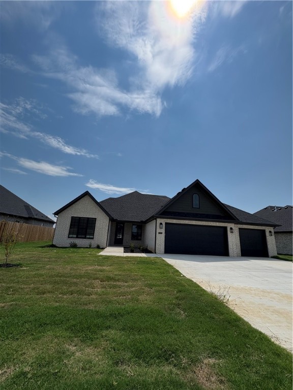 What else would. you want?? This single-story home invites you in with an open floor plan, vaulted ceilings, large living area with electric fireplace in the living room. Another room just off living room that could be used as a 5th bedroom/flex or office space plus four other spacious bedrooms, three full bathrooms, and generous utility room, laundry, pantry, walk in closets, and a three-car garage. Designer-chosen finishes and details; paint colors, countertops, tile, engineered wood flooring, accent walls, and under counter lighting. It comes with fence, gutters and blinds. The community has a nice pavilion, pool and playground. Preferred lender offering $5000.00 to be used for either rate buy-down or closing costs. Situated minutes from I-49, Golf Courses, Winery, Arvest Ballpark, Arkansas Children's Hospital and good restaurants! Lender credits offered with preferred lender.