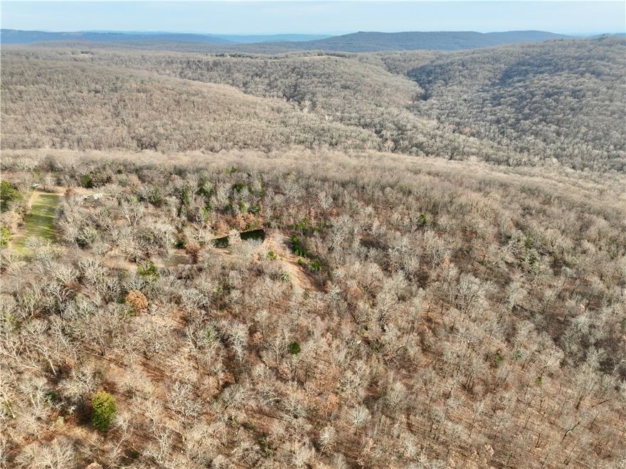 Spectacular hunting and recreational property in the Boston Mountains featuring privacy and seclusion with a gated entrance and easy access to Chester, AR, and I-49. Strictly managed with a proven track record, the land supports abundant deer, turkey, and bear. Highlights include established food plots, multiple stand sites, stocked ponds, a seasonal creek, extensive ATV trails, hardwood timber, and a scenic campsite with panoramic mountain views.